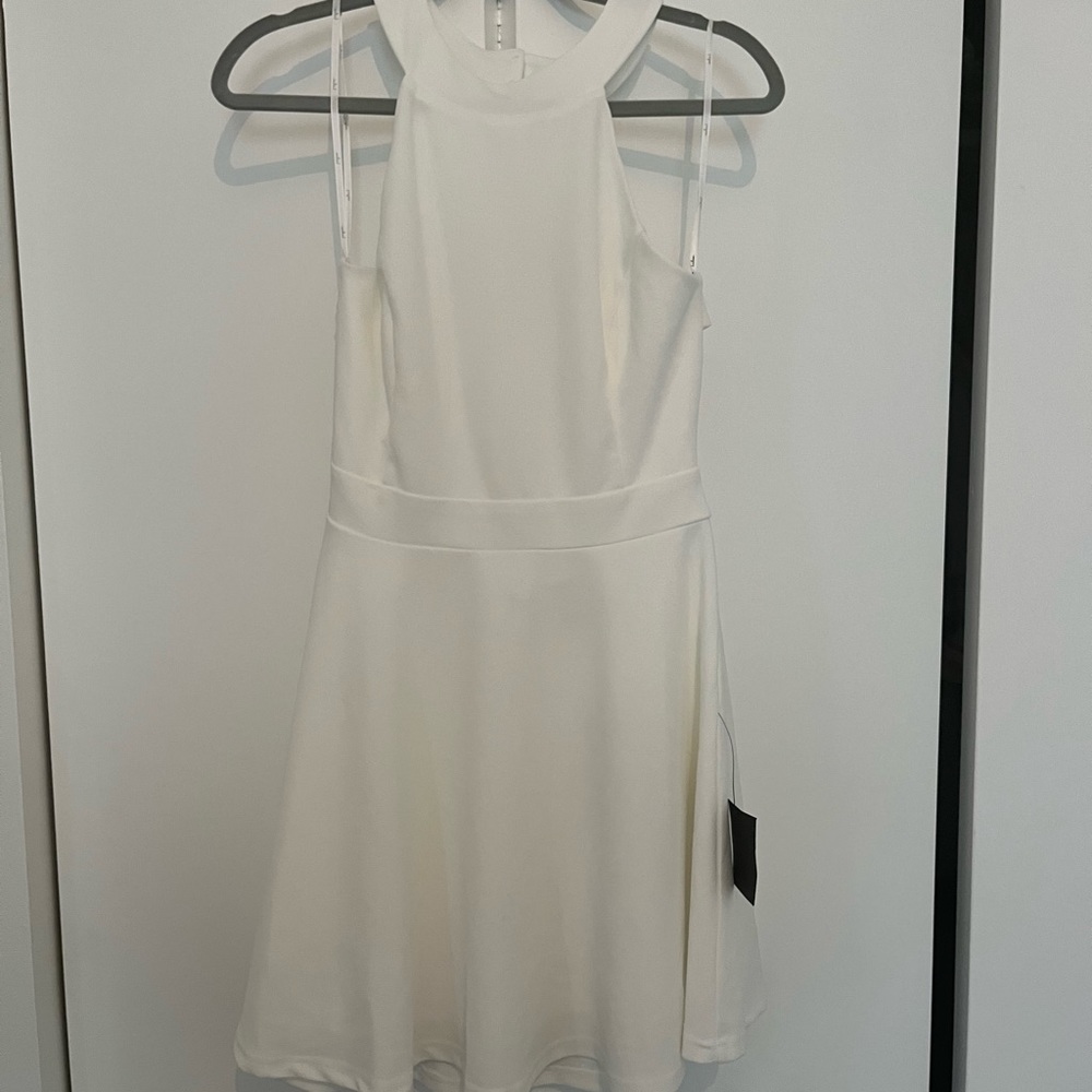 Lulus “Keep Coming Back White Backless Skater Dress” size L. Tags on, never worn